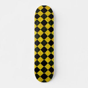 Zwart en geel ingecheckt patroon skateboard