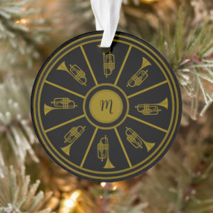 Zwart en goud motief met trompetten en een monogra ornament