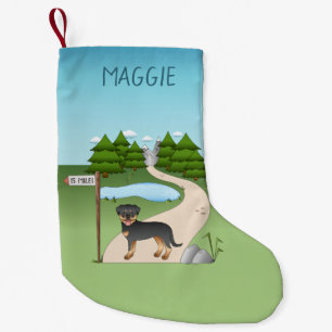 Zwart en roodbruine Rottweiler-hond bij een wandel Kleine Kerstsok
