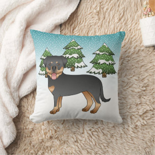 Zwart en roodbruine Rottweiler-hond in een winterb Kussen