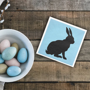 Zwart konijntje silhouet vorm hoge oren op blauw servet