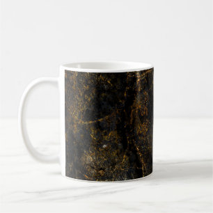 Zwart marmer, gouden aderen, textuur. koffiemok