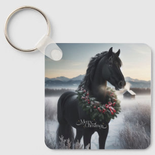 Zwart paard in de sneeuw met kerstkrans sleutelhanger