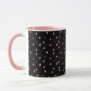 Zwart roze koffie mok versierd met harten bladeren