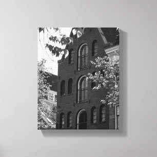 Zwart-wit historisch gebouw in Amsterdam Canvas Afdruk