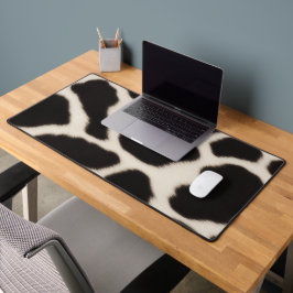 Zwart-wit koeienhuid bureaumat