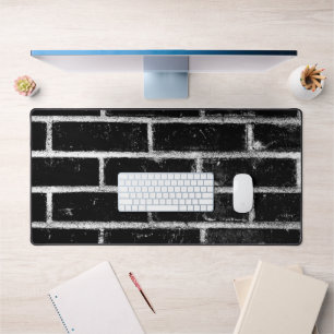 Zwart-witte bakmuur bureaumat