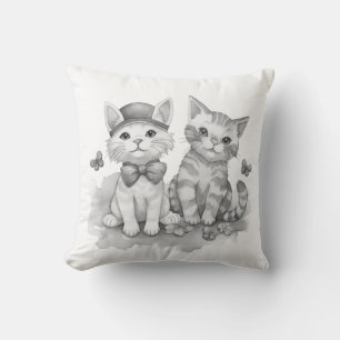 Zwart-witte katjes kussen