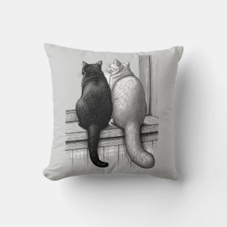 Zwart-witte katten bij het raam kussen