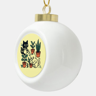 Zwart-witte katten tuinieren met planten keramische bal ornament