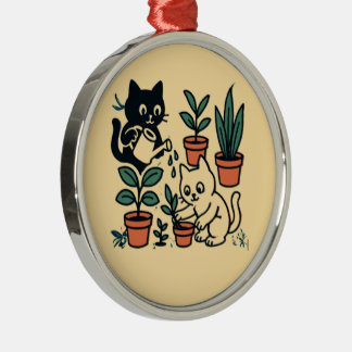 Zwart-witte katten tuinieren met planten metalen ornament