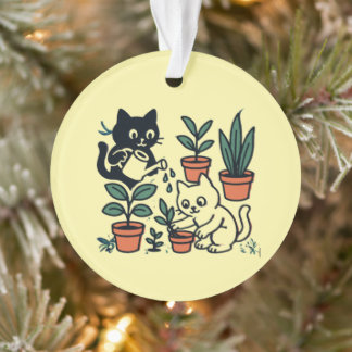 Zwart-witte katten tuinieren met planten ornament