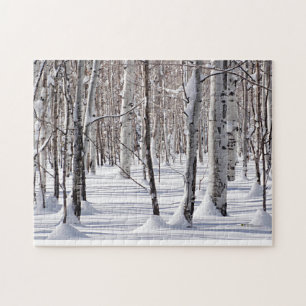 Zwart-witte ruitboomstammen in sneeuwfoto legpuzzel