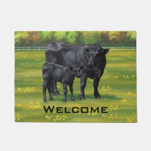 Zwarte Angus-Koe en Cute Calf in zomerperiode Deurmat