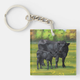 Zwarte Angus-Koe en Cute Calf in zomerperiode Sleutelhanger
