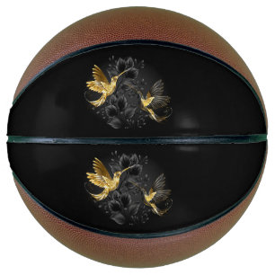 Zwarte en goudvogel basketbal