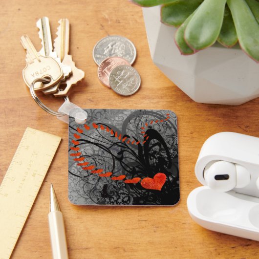 Zwarte en rode halve kruipen sleutelhanger (Bureau)