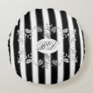 Zwarte en witte strepen met grijze bladeren rond kussen