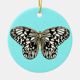 Zwarte en witte vlinder, achtergrond turkooizen keramisch ornament