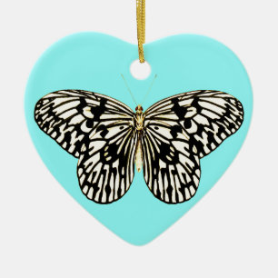 Zwarte en witte vlinder, achtergrond turkooizen keramisch ornament