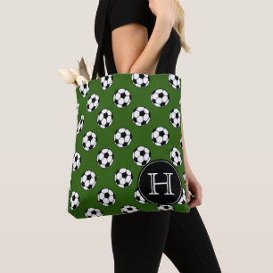 Zwarte en witte voetballen op groene monogram draagtas