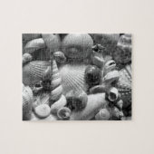 Zwarte en witte zeeschelpen legpuzzel (Horizontaal)