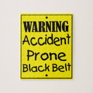 Zwarte gordel voor ongevalsProne Legpuzzel