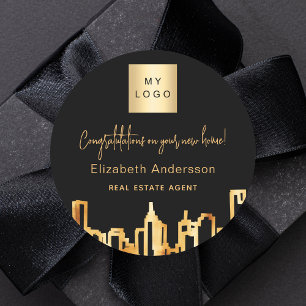 Zwarte goudstad skyline onroerend goed logo ronde sticker