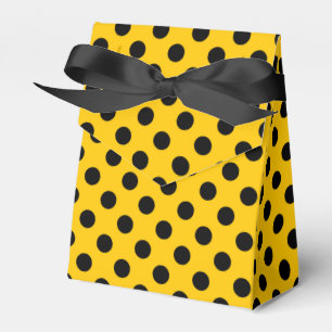 Zwarte haarpunten op geel bedankdoosjes