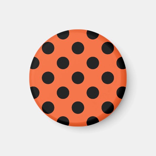 Zwarte haarpunten op oranje magneet (Voorkant)