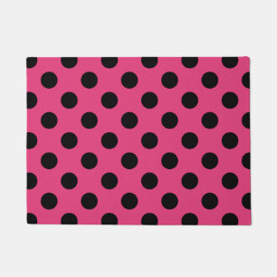 Zwarte haarvlekken op fuchsia deurmat