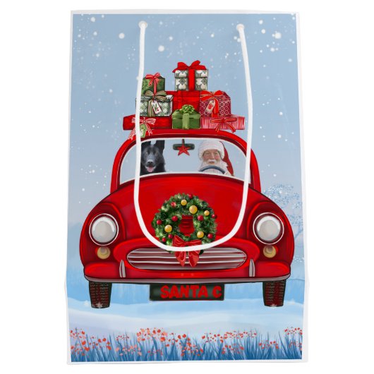 zwarte herderhond in auto met kerstman medium cadeauzakje (Achterkant)