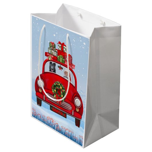 zwarte herderhond in auto met kerstman medium cadeauzakje (Achterkant Gekanteld)