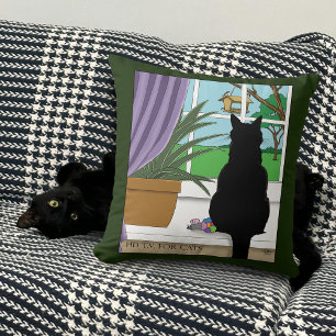 Zwarte kat die uit venster kijkt kussen