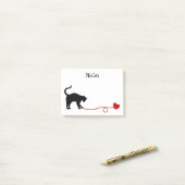 Zwarte kat en hartritmedanten (rood) post-it® notes (Op bureau)