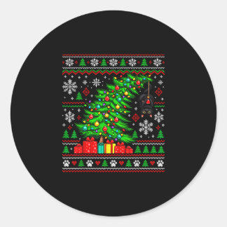Zwarte kat hangend aan kerstboom feestelijke huisd ronde sticker