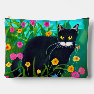 Zwarte kat in een kleurrijke bloementuin etui