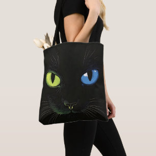 Zwarte kat met groene en blauwe ogen draagtas