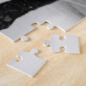 Zwarte kat ontspannen op bank legpuzzel (Zijkant)