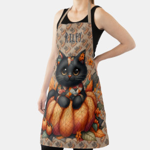 Zwarte kat op pompoen met herfst quilt patroon schort