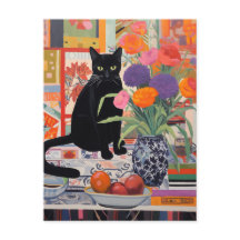 Zwarte Kat op tafel met boeken bloemen fruit