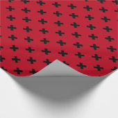 Zwarte kruisstift op rood cadeaupapier (Hoek)