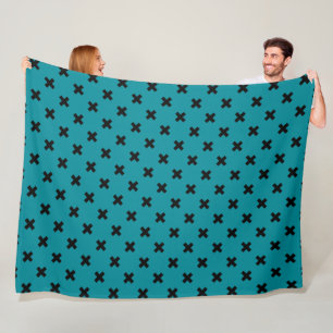 Zwarte kruisstiften op blauwgroen fleece deken
