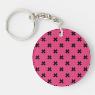 Zwarte kruisstiften op fuchsia sleutelhanger