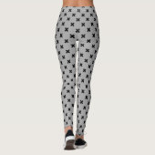 Zwarte kruisstiften op grijs leggings (Achterkant)