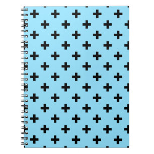 Zwarte polka kruist op babyblauw notitieboek