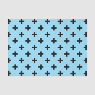Zwarte polka kruist op babyblauw tissuepapier