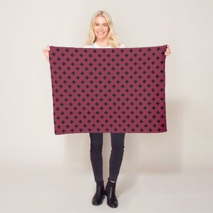 Zwarte polka kruist op moerbei fleece deken