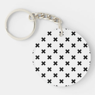 Zwarte polka kruist wit sleutelhanger