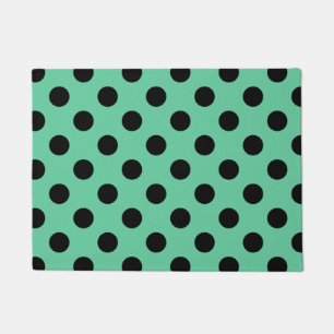 Zwarte polka-punten op muntgroen deurmat